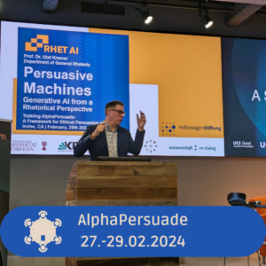 Beitragsbild zeigt Olaf Kramer auf der Bühne am Rednerpult bei seiner Keynote zu "Persuasive Machines" bei der AlphaPersuade Tagung.